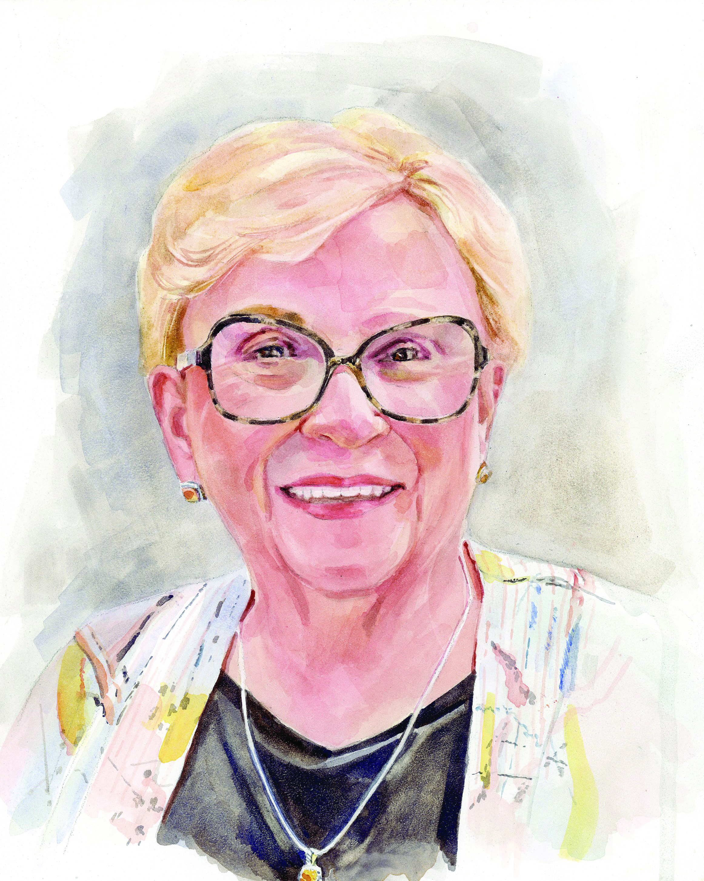 This is a watercolor portrait of a smiling elderly woman with short, light blond hair. She is wearing glasses with thick rims, and her expression is warm and welcoming. The woman is dressed in a light-patterned outer garment, possibly a vest, over a black top. She is also wearing a silver necklace with a small pendant and matching earrings. The background of the portrait is softly blended in mute