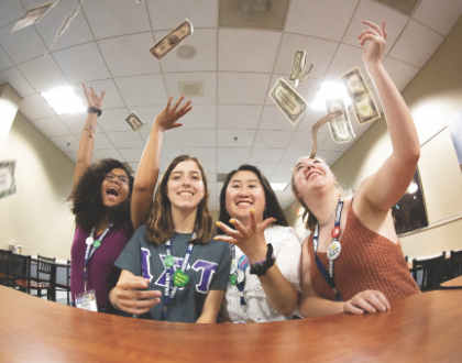 Alum Weekend - Girls throwing money